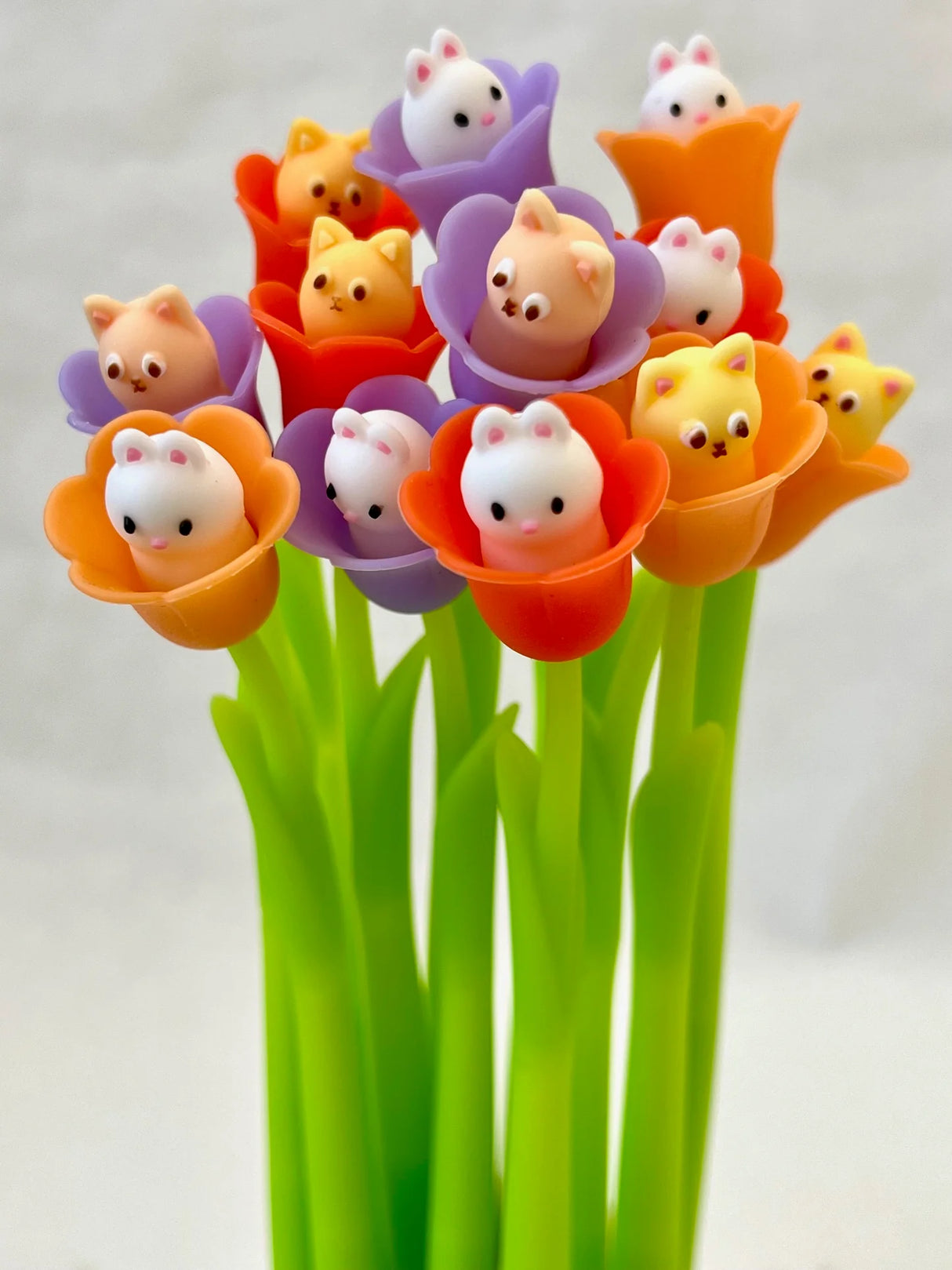 Bluebells Wiggle Gel Pen featuring adorable cat and bunny critters in colorful flower tops with green stems.