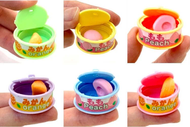 Japanese Eraser Fruit in a Can showing assorted colorful fruit-shaped erasers in small cans for kids.