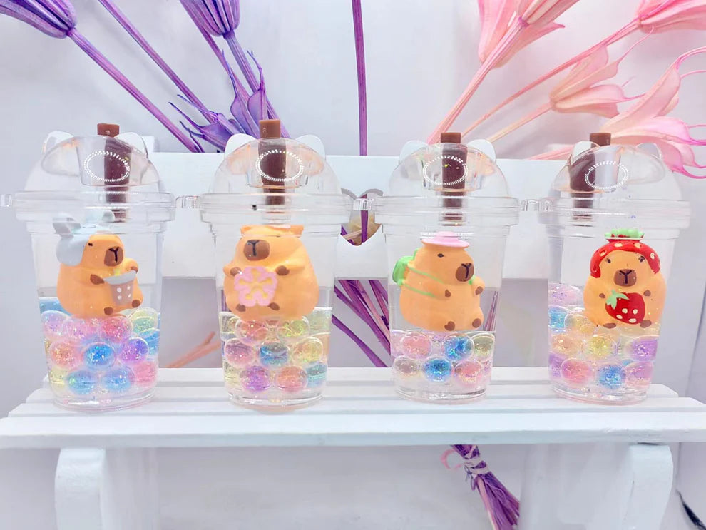 Capybara Boba Floaty Keychain featuring cute capybaras in drinks with colorful beads, perfect for keys or bags.