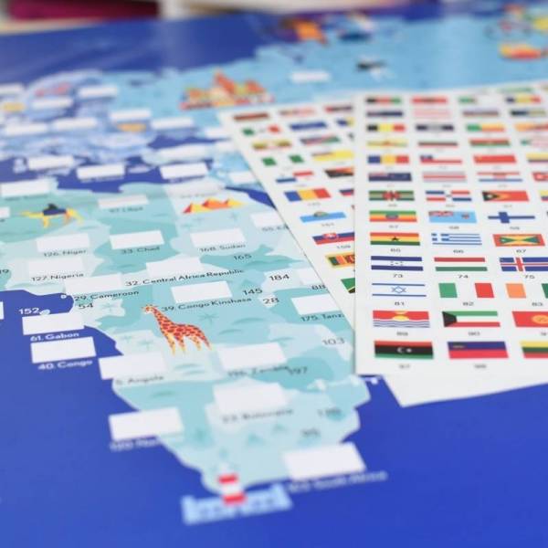 Poppik Discovery Poster Flags with a map and sticker sheet for placing world flags in their correct locations.