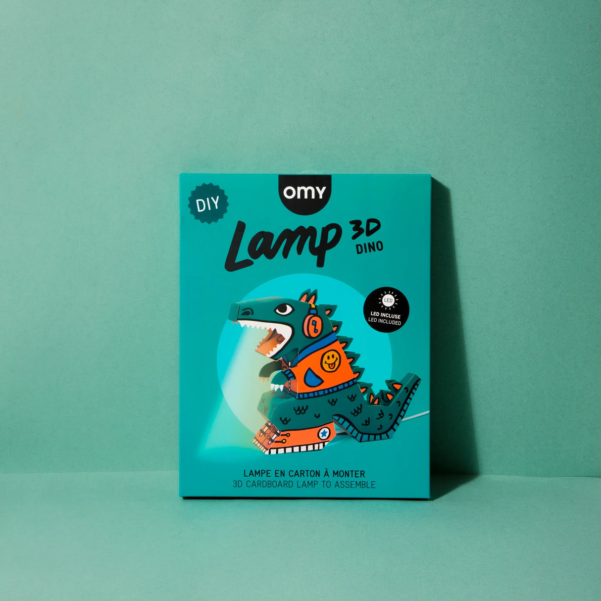 3D DIY Lamp | Dino packaging showing a colorful dinosaur design on a teal background for creative assembly night light.