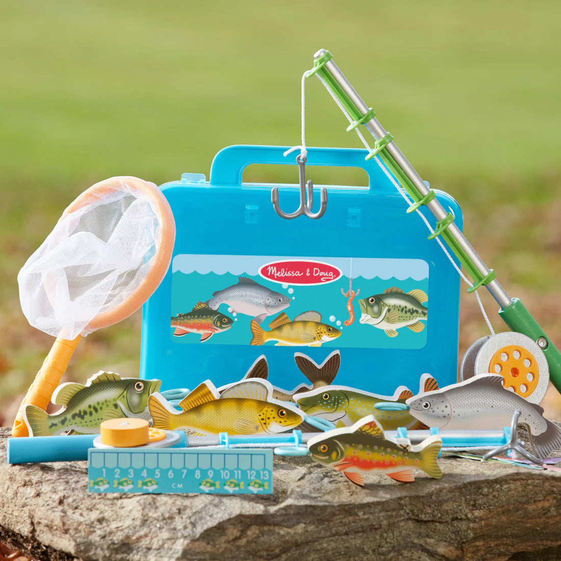Let's Explore Fishing Play Set with wooden rods, fish, net, and reversible mat for imaginative fishing fun outdoors or indoors.