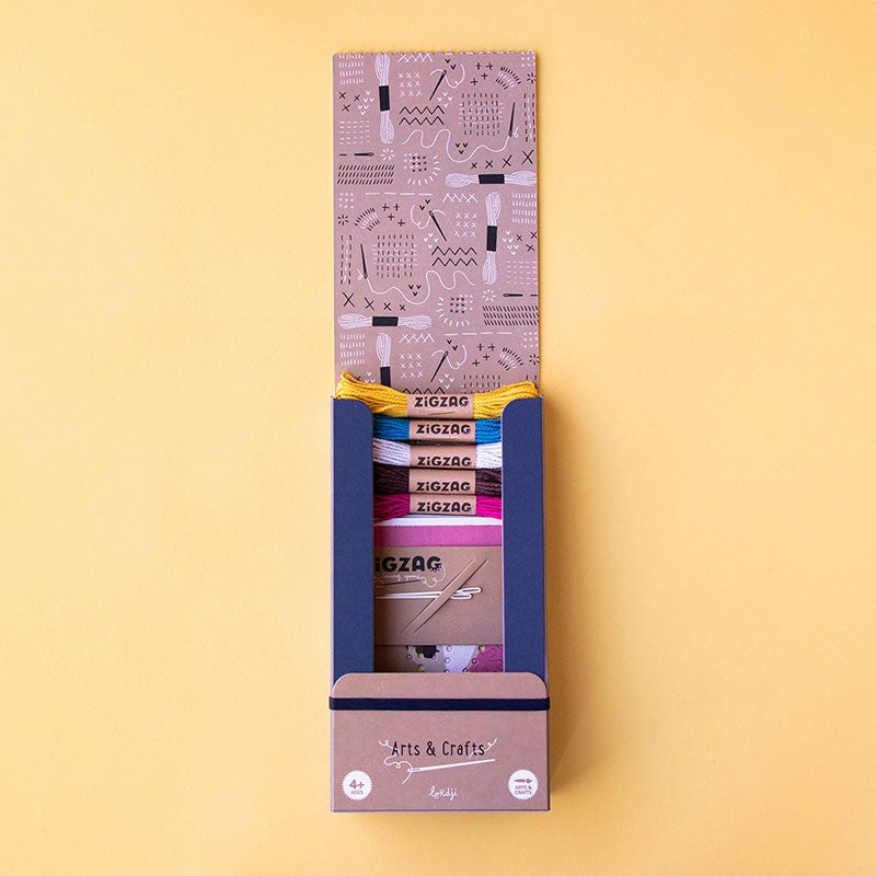 ZigZag Lacing embroidery kit with colored wool, needles, and cardboard templates for sewing beginners ages 5 and up.