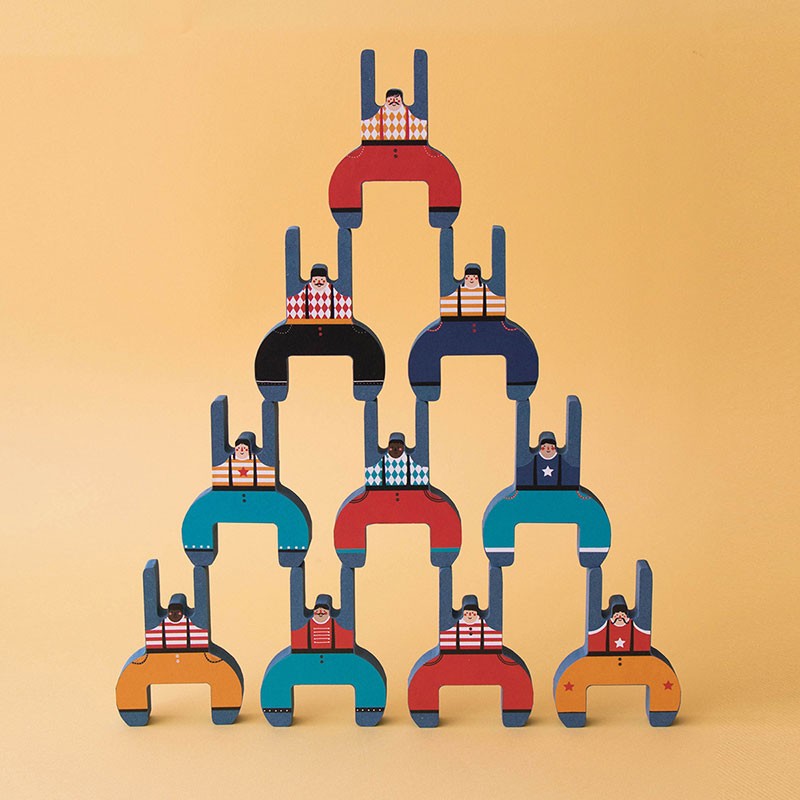 Acrobat Balancing Game showing colorful wooden acrobats stacked in a human tower against a plain background.