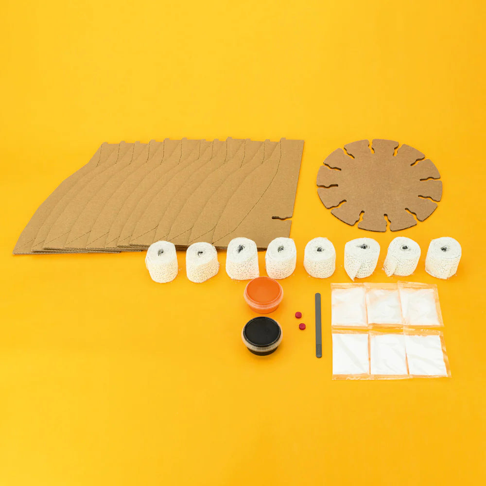 Massive Erupting Volcano kit with cardboard pieces, plaster strips, paints, and chemicals for erupting volcano model.