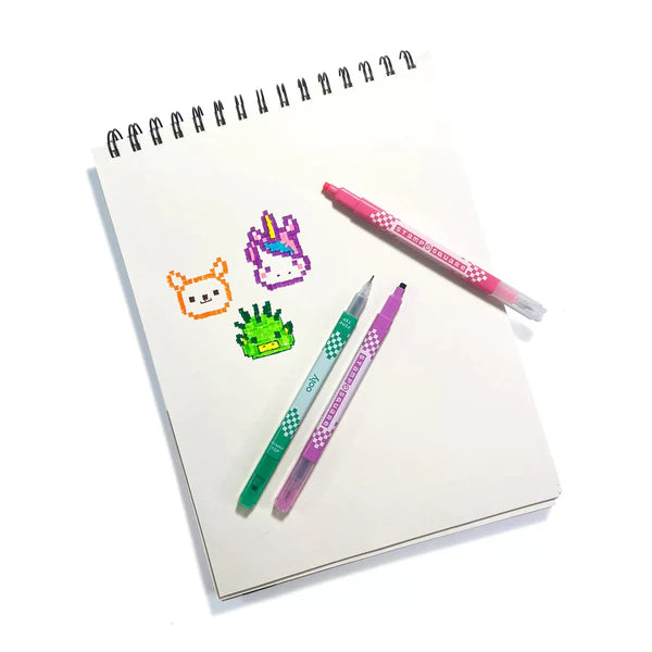 Stamp A Square Markers with pixel art stamps and fine tips shown on a sketchpad with colorful designs.