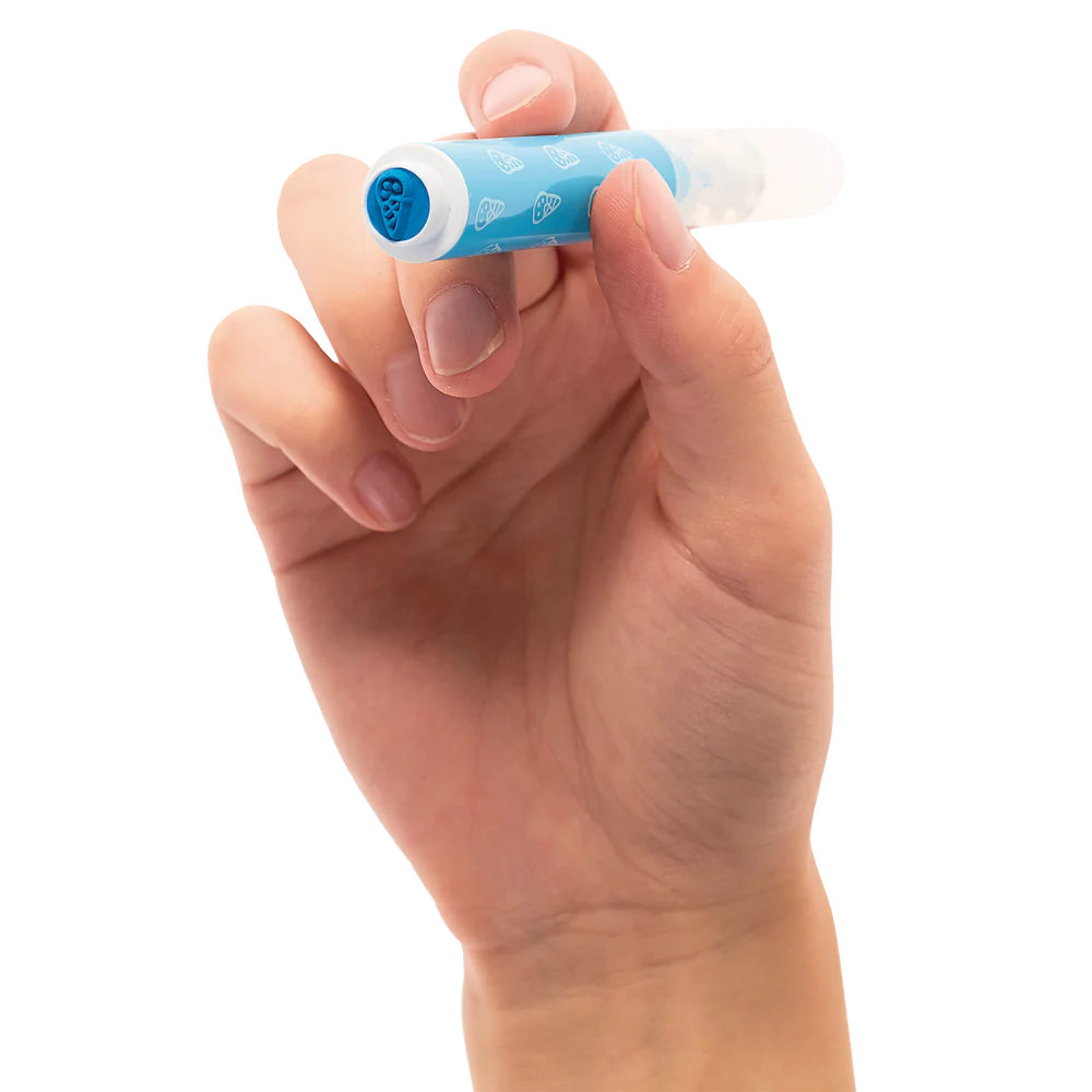 Hand holding a blue Stampables Double-Ended Stamp Marker with ice cream cone stamp tip visible.