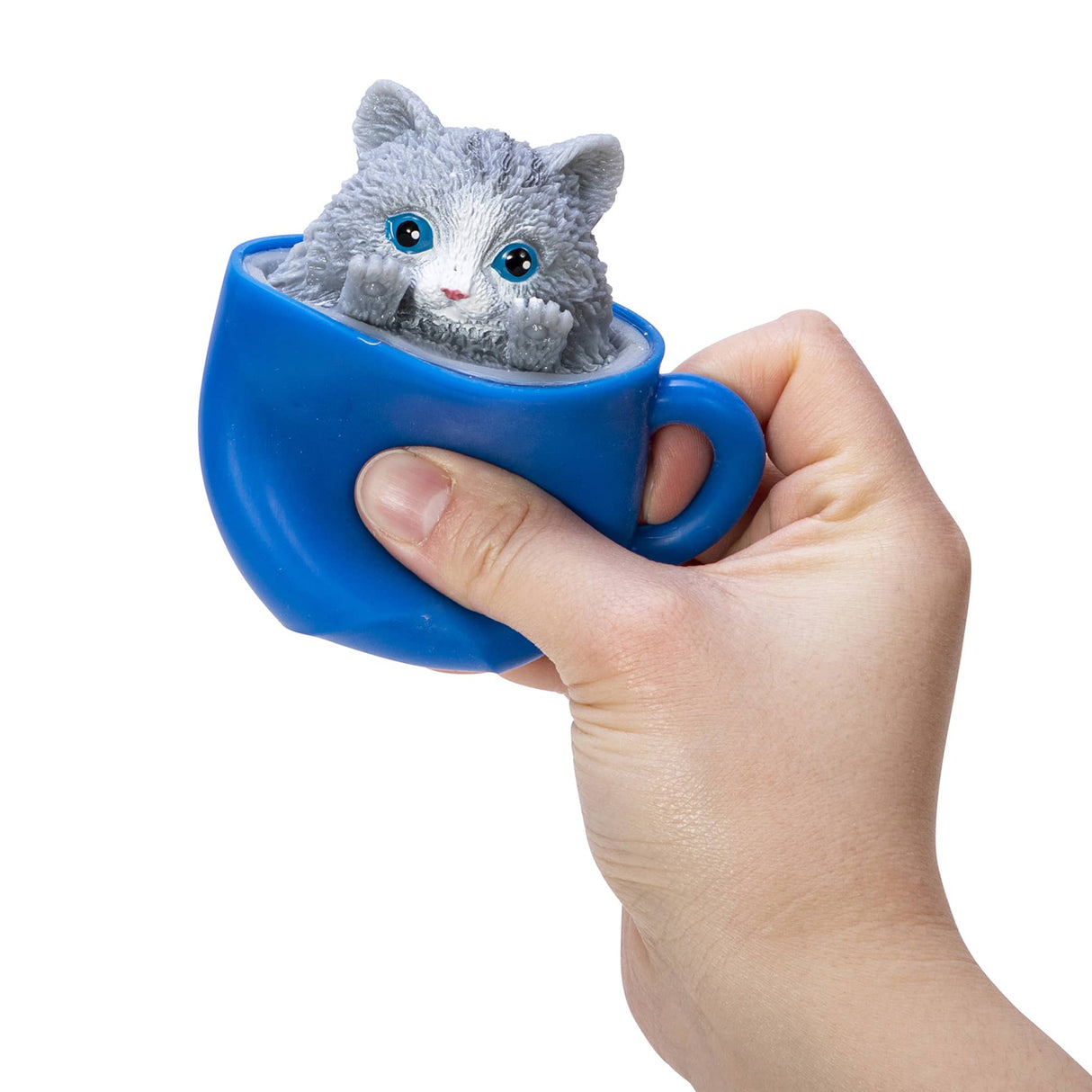 Hand squeezing blue cup with gray kitten popping out from inside for Pop a Chino Kitties! collectible toy.