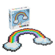 Plus Plus Puzzle by Number Rainbow showing a completed colorful rainbow puzzle with clouds on a blue background.