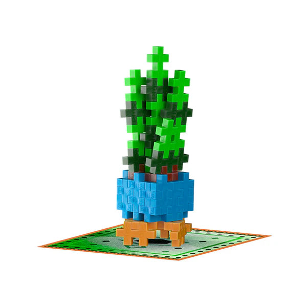 Plus Plus Playful Plant Packet with green buildable plant in blue pot on themed mat for creative play and display.