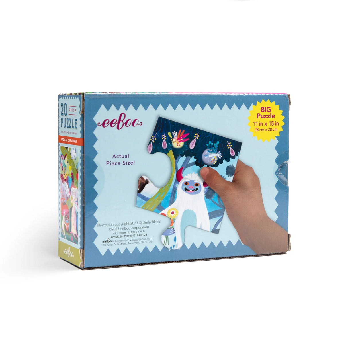 20pc Magical Creatures Puzzle box showing large puzzle piece with colorful magical creature illustration held by child’s hand.
