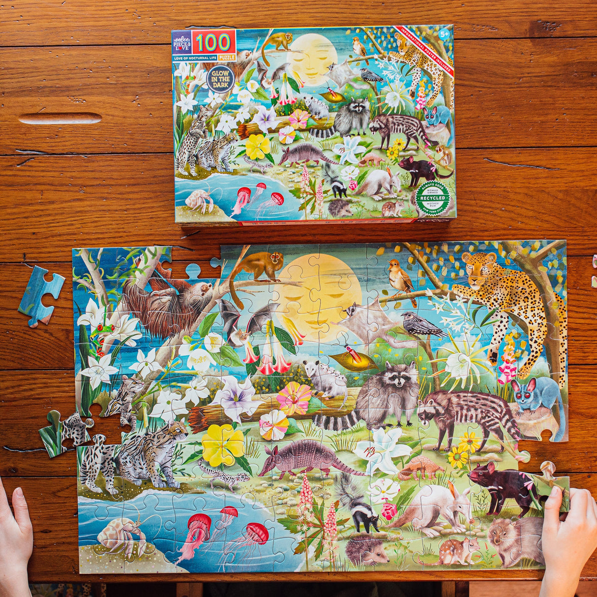 100pc Love of Nocturnal Life Puzzle with glow-in-the-dark animals featuring vibrant night creatures and flowers.