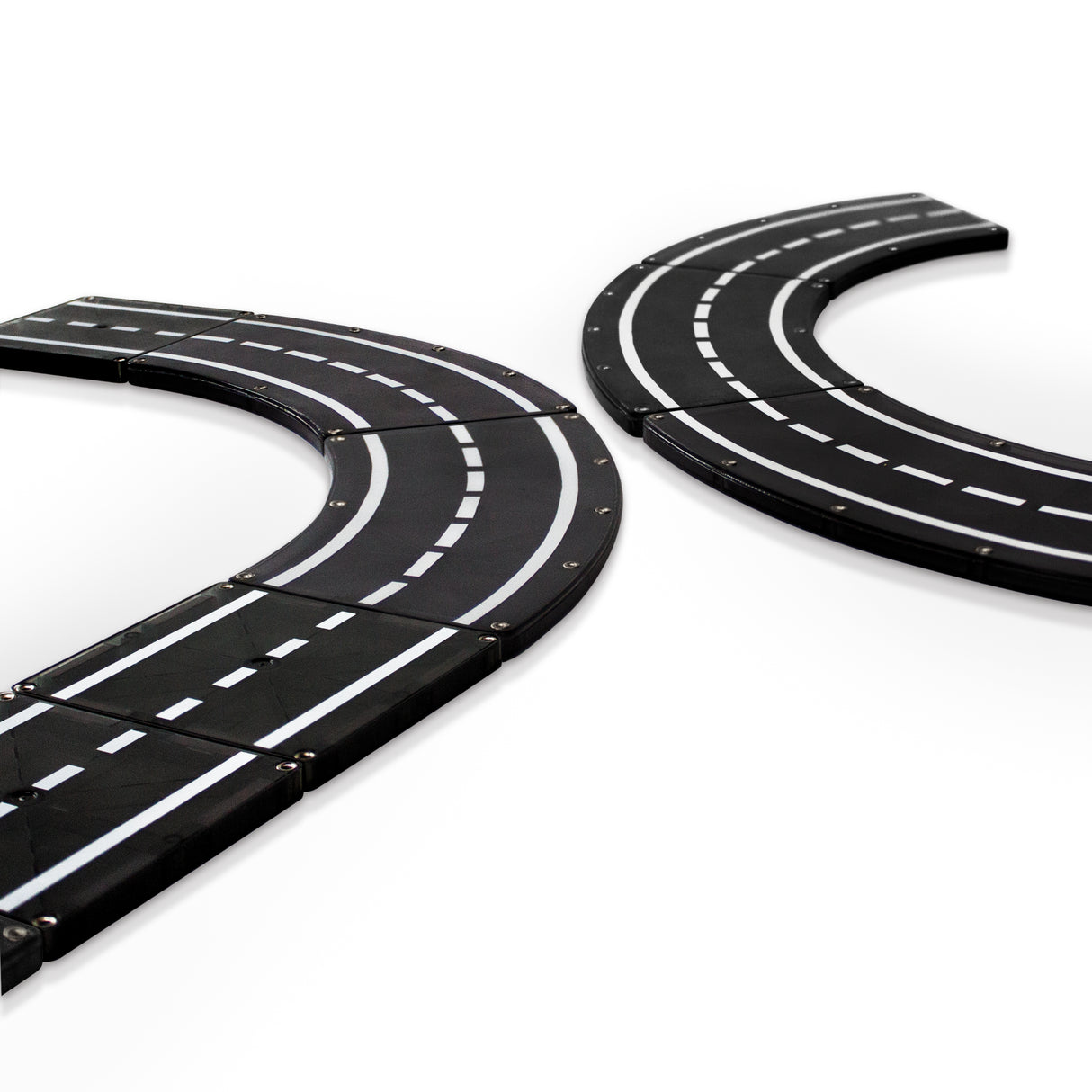Magnatiles Xtras Roadway 12pc showing magnetic black road pieces forming curved and straight sections for building tracks.