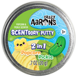 Crazy Aaron’s SCENTsory Duos Popcorn Pickle Thinking Putty with yellow popcorn and green pickle scented putty.
