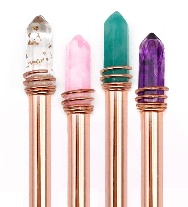 Mystic Crystal Pen set with rose gold barrels and assorted crystal tops in clear, pink, green, and purple colors.