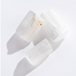 Rock | Natural Selenite crystals in varying sizes with white translucent and textured gypsum surfaces.