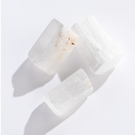 Rock | Natural Selenite crystals in varying sizes with white translucent and textured gypsum surfaces.