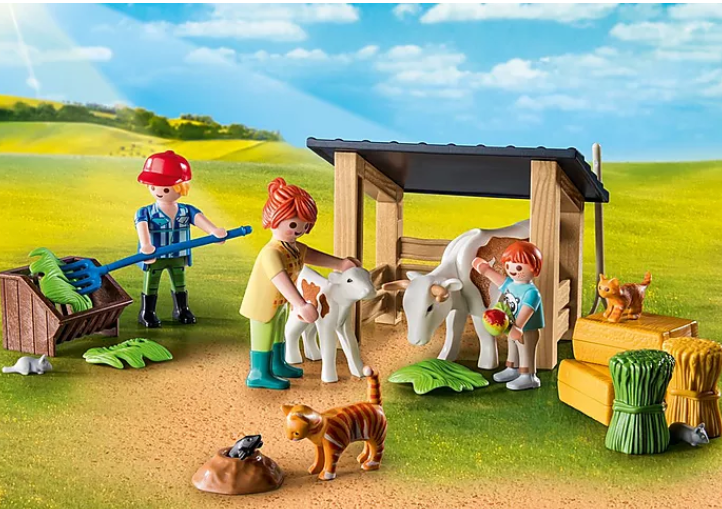 Country | Farmhouse with Outdoor Area Playmobil set showing figures with animals and farm accessories in a sunny rural scene.