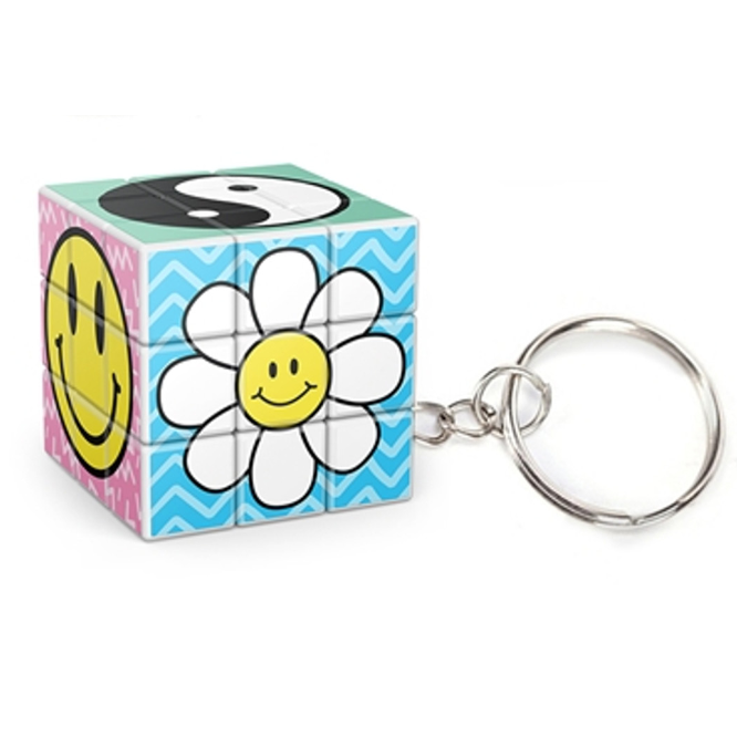 Cube-Dini Mini: Totally 90's Keychain showing a colorful puzzle cube with smiley face, flower, and yin-yang designs.