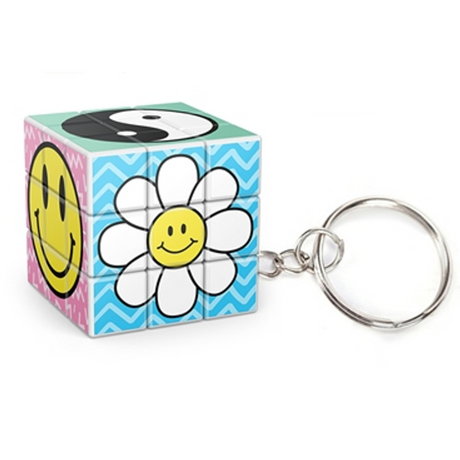 Cube-Dini Mini: Totally 90's Keychain showing a colorful puzzle cube with smiley face, flower, and yin-yang designs.