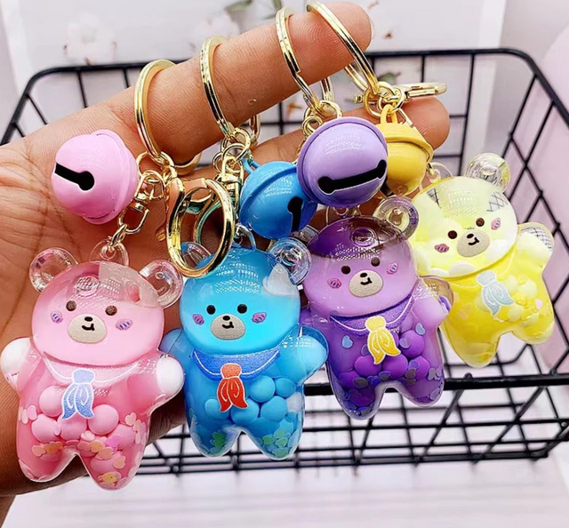 Bear Floaty Charm Keychain with colorful bear design and bell, perfect for bags, keys, or backpacks.
