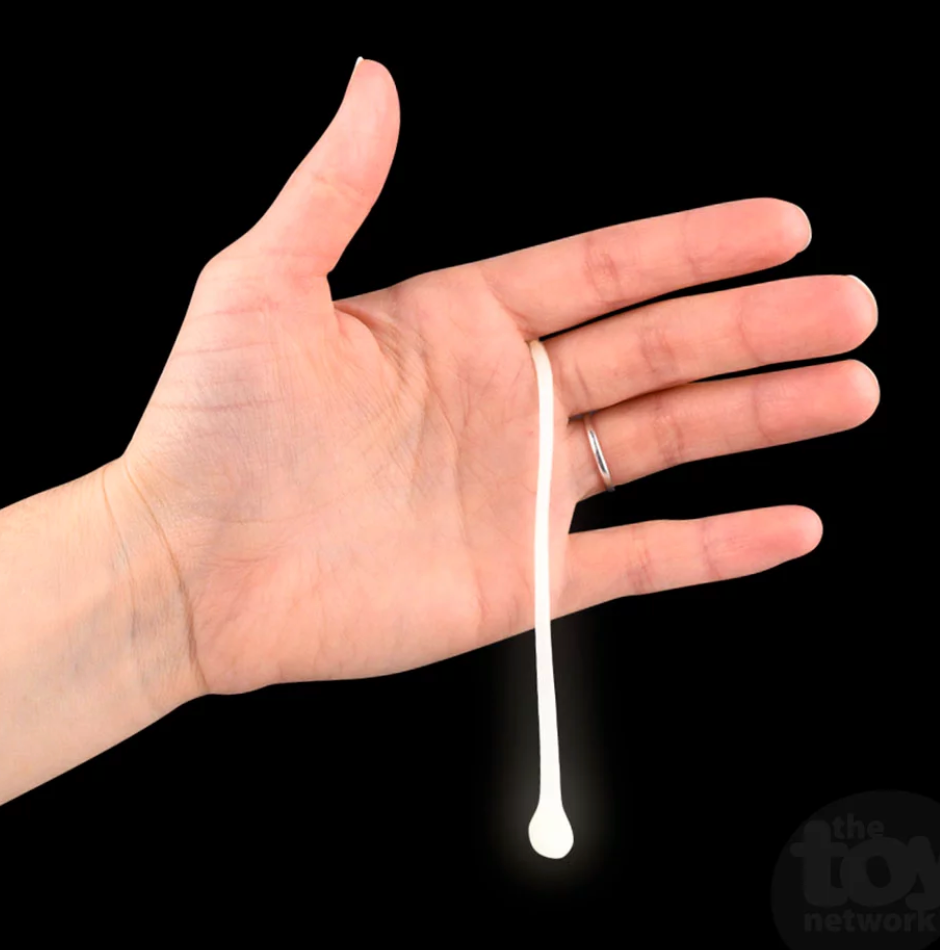Glow in the Dark Snot stretched from fingers glowing white in the dark against black background.