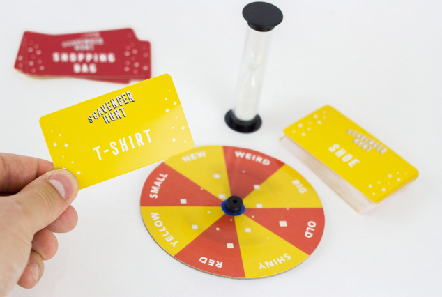 Scavenger Hunt game with spinner, timer, and cards including a yellow T-shirt card for family fun.