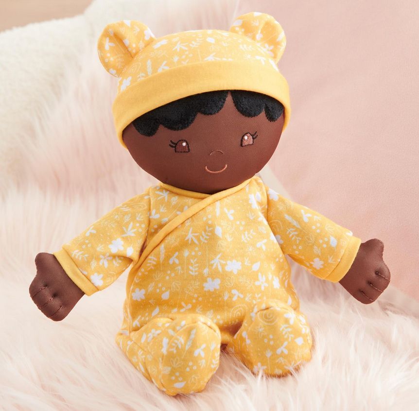 Recycled Baby Doll | Camellia in yellow floral onesie and hat, soft plush doll made from 100% recycled materials.