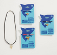 Shark Tooth Necklace with genuine fossilized shark tooth on a microsuede cord in assorted colors, ready to wear.