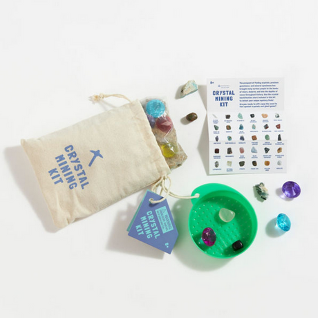 Crystal Mining Kit with cotton drawstring bag, plastic sifter, colorful crystals, acrylic gems, and instruction guide.