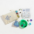Crystal Mining Kit with cotton drawstring bag, plastic sifter, colorful crystals, acrylic gems, and instruction guide.