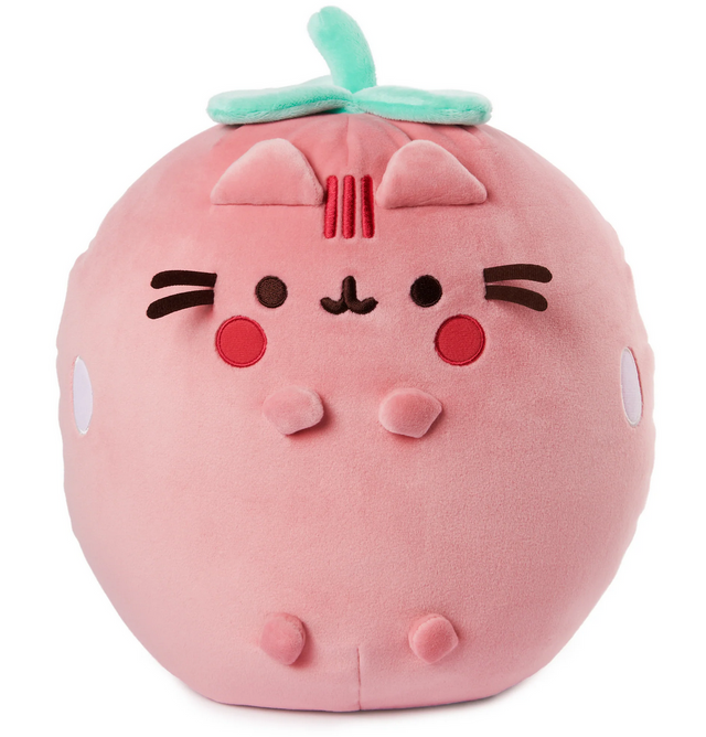 Pusheen Strawberry plush in soft pink with embroidered seeds, green leafy stem, rosy cheeks, and huggable design.