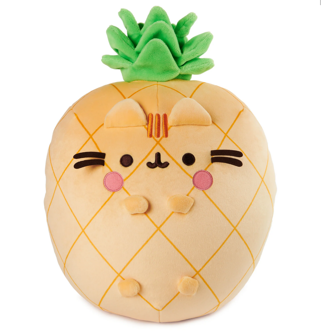 Pusheen Pineapple plush, an 11” soft, pineapple-shaped cat with green leaves and rosy cheeks, perfect for hugging and squeezing.