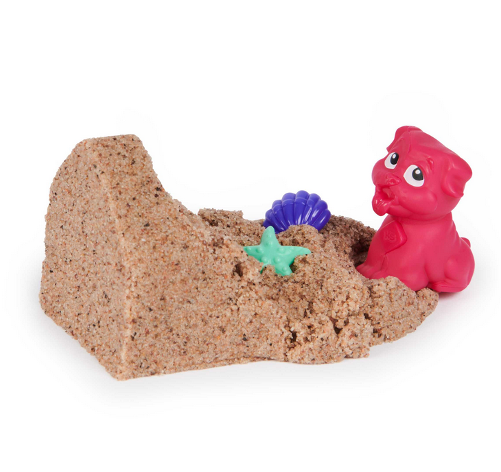 Kinetic Sand Doggie Dig with red dog figure digging sand and hidden blue shell and green star treasures.