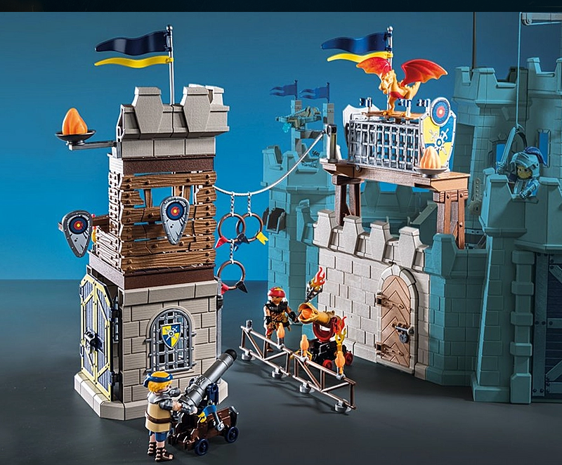 Novelmore | Tournament Arena featuring knights, castle towers, cannons, targets, and a dragon for epic jousting battles.