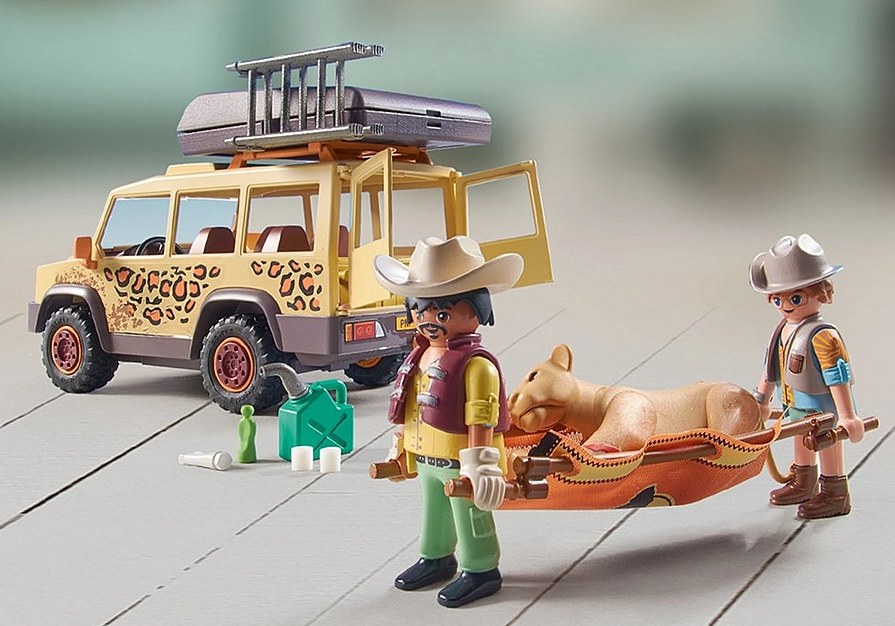 Wiltopia Cross-Country Vehicle & Lions playset with solar vehicle, two figures, and injured lion rescue scene.