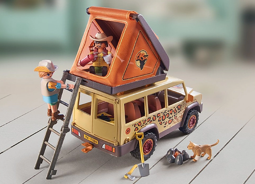 Wiltopia Cross-Country Vehicle & Lions playset with off-road vehicle, tent, figures, and animal in natural setting.