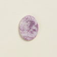 Soothing Stone | Lepidolite with a soft matte finish, oval shape, and calming purple tones for wellness practices.