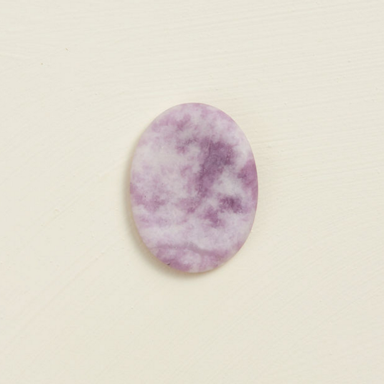 Soothing Stone | Lepidolite with a soft matte finish, oval shape, and calming purple tones for wellness practices.