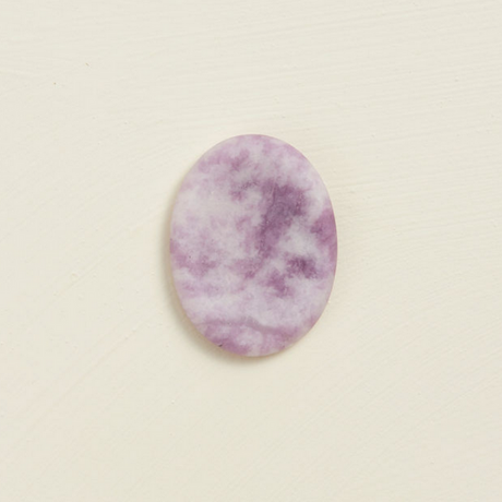 Soothing Stone | Lepidolite with a soft matte finish, oval shape, and calming purple tones for wellness practices.