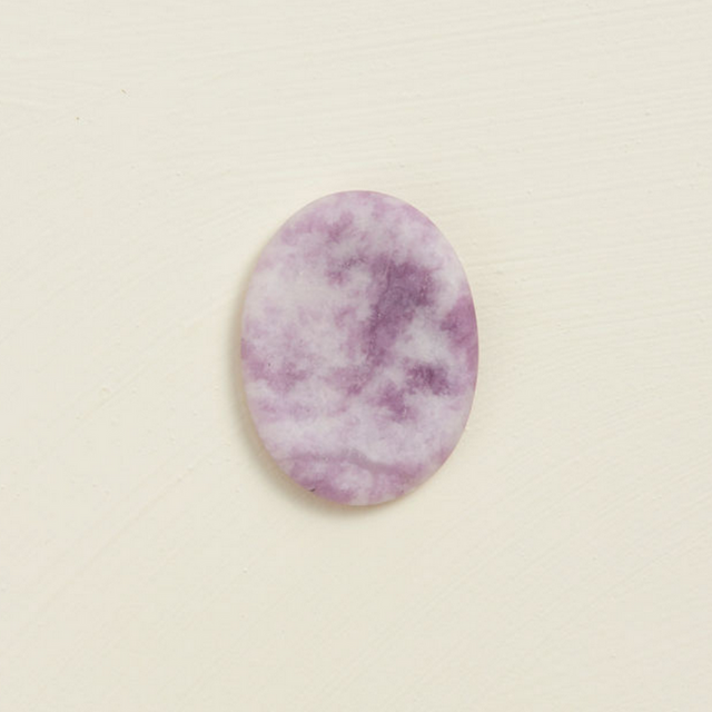 Soothing Stone | Lepidolite with a soft matte finish, oval shape, and calming purple tones for wellness practices.
