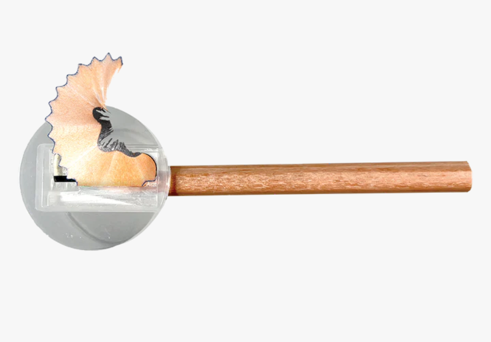 Draw 'n Doodle Mini Colored Pencils & Sharpener showing a sharpened pencil and shavings in a compact sharpener.