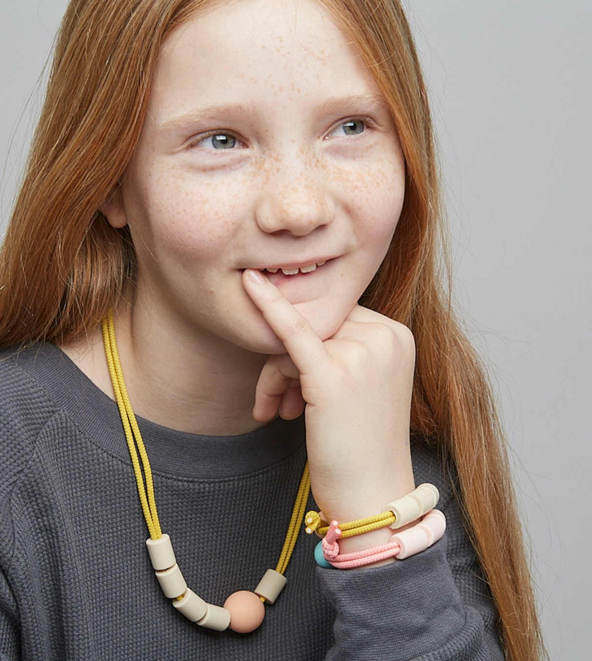 Adventure Sensory Bracelet | Honey worn by child, featuring adjustable non-toxic beads and double layered rope design.