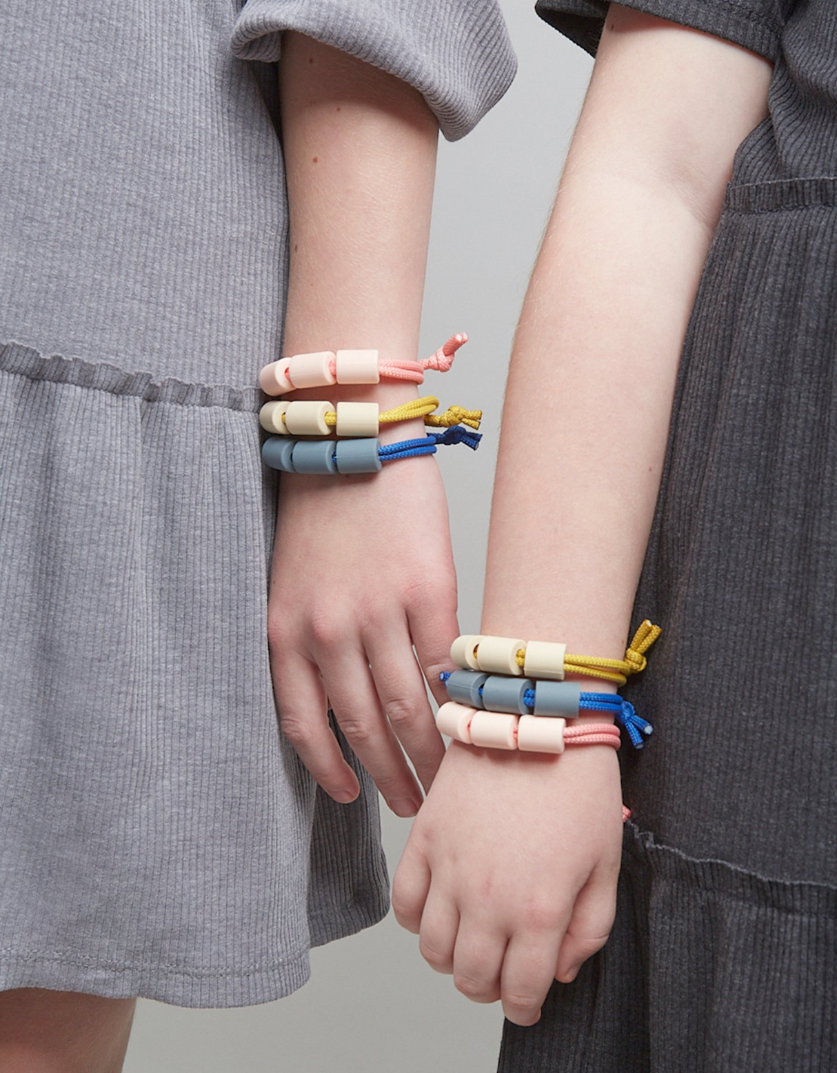 Adventure Sensory Bracelet | Honey shown worn on children's wrists with layered rope and colorful beads.