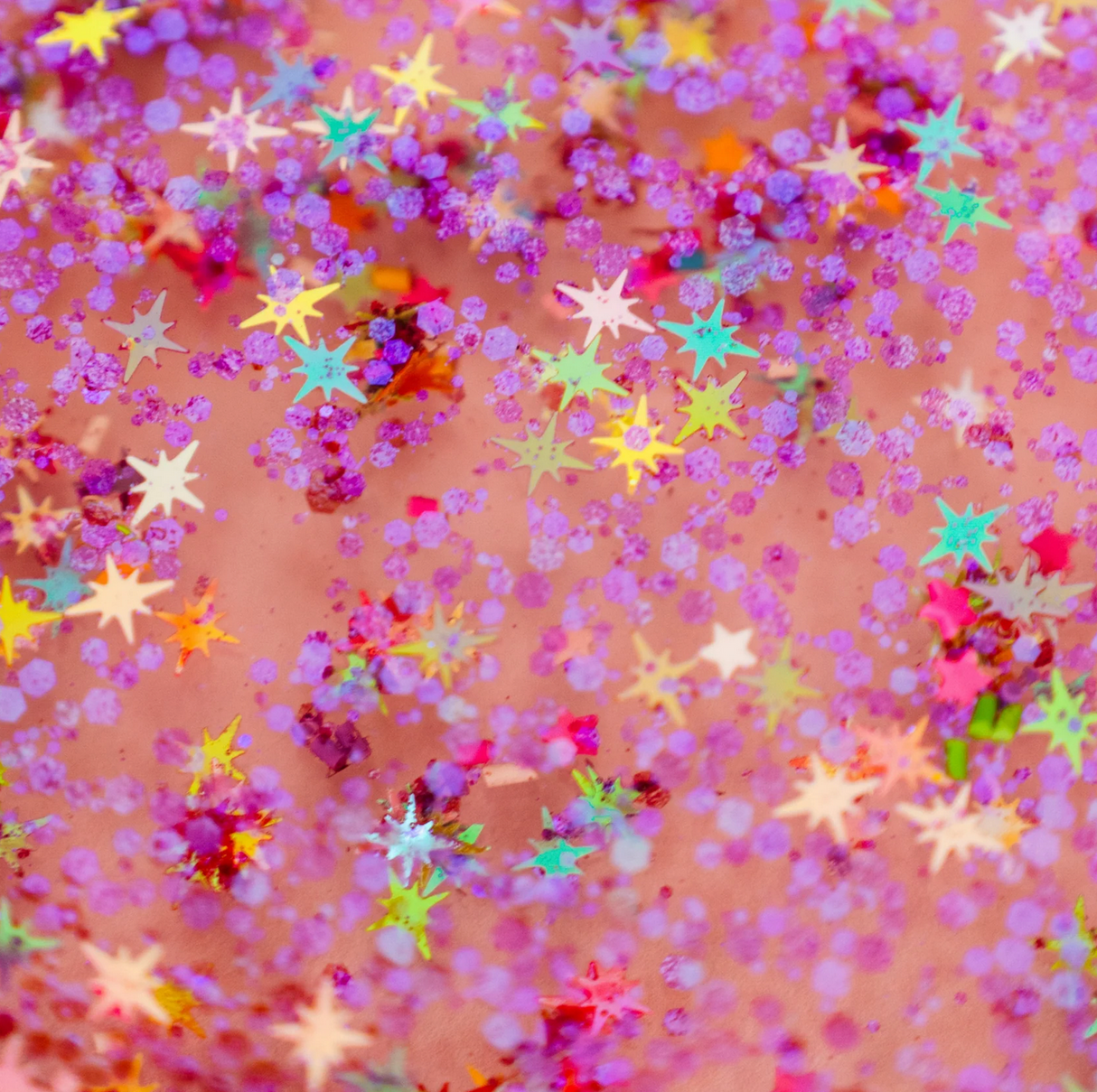 Sensory Jar Fun Fillers | Outer Space with colorful star-shaped and purple sensory accessories for creative playtime.