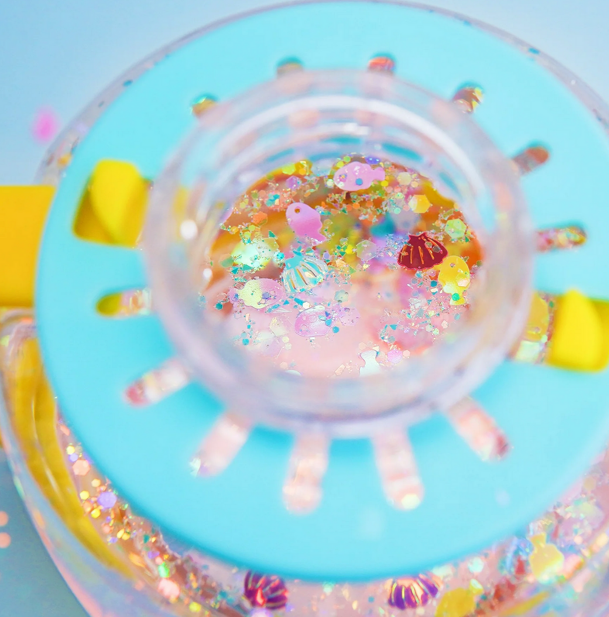 Sensory Jar Fun Fillers | Under the Sea with colorful sea-themed sensory accessories inside a clear jar lid.