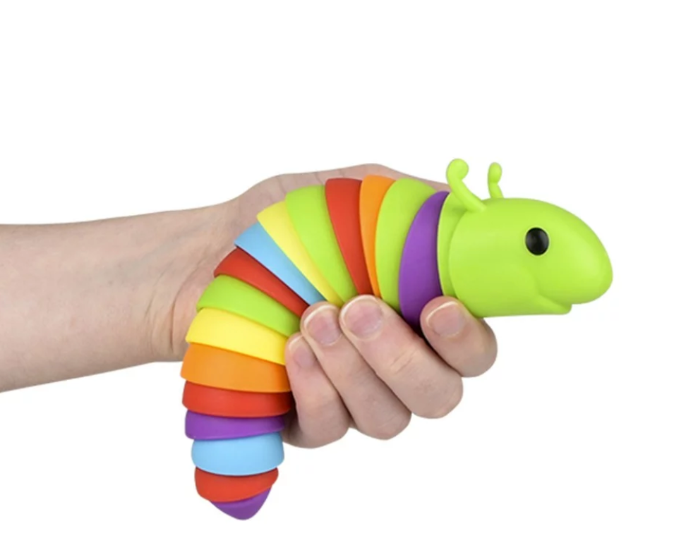 Hand holding a colorful 7.5" Sensory Wiggle Caterpillar toy that wiggles and squiggles when shaken.