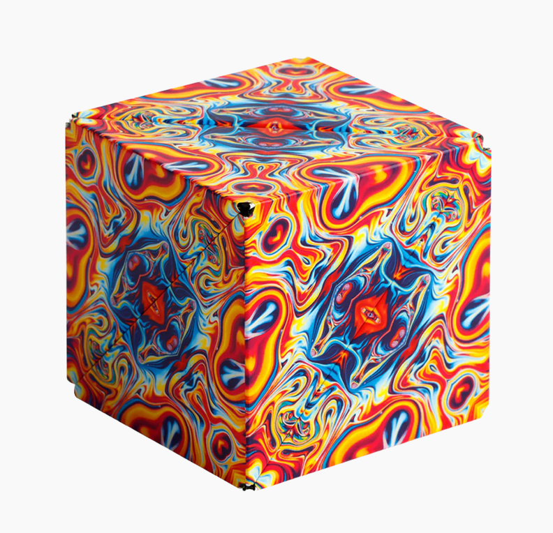 Shashibo | Spaced Out magnetic puzzle cube with vibrant swirling colorful design on a 2.4 inch recyclable ABS cube