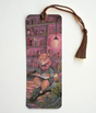Bookmark | Reading Shiba featuring a scholarly Shiba Inu dog reading with a brown tassel and cozy library background.
