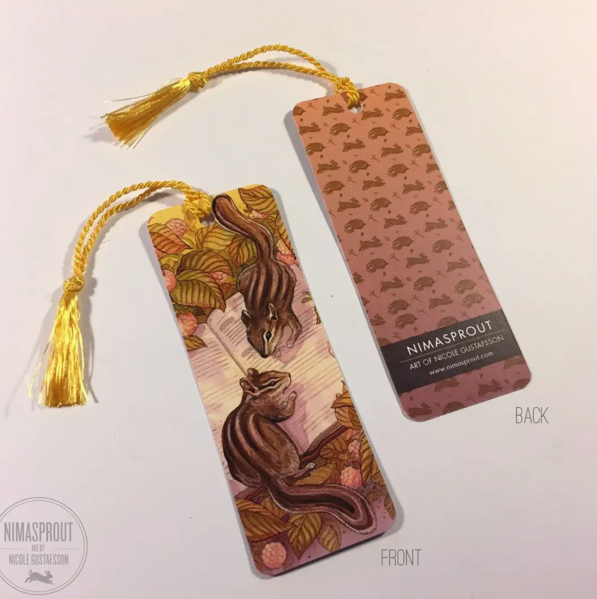Bookmark | Chipmunk with two chipmunks reading under leaves and a golden tassel, showcasing front and back designs.